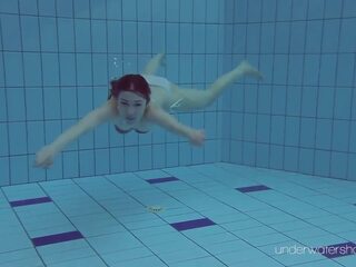 White swimsuit with tattoos – seductress Roxalana Cheh underwater