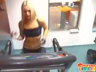 Tanned blonde hottie reveals her shaved minge in the gym